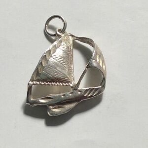Vintage sailboat diamond cut sterling silver pendant.